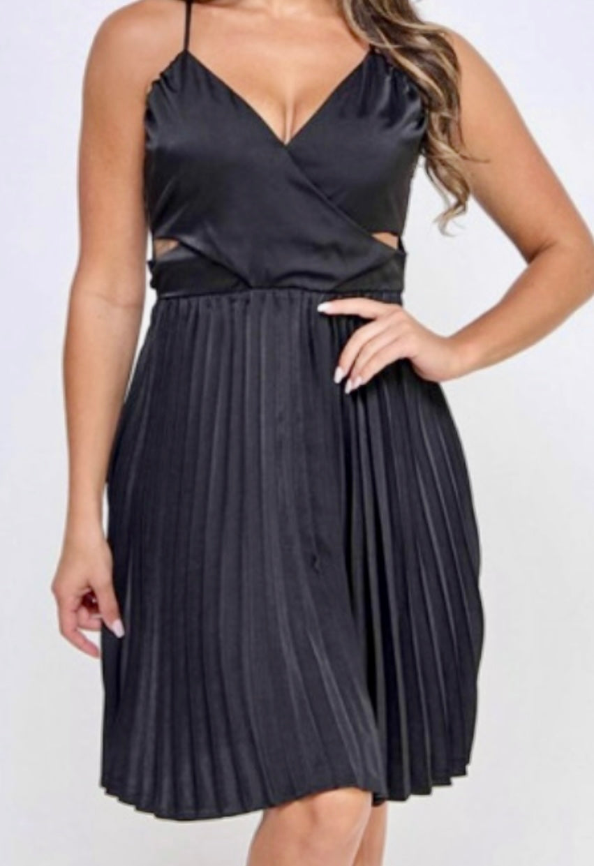 Black dress with cut-out design on a white background