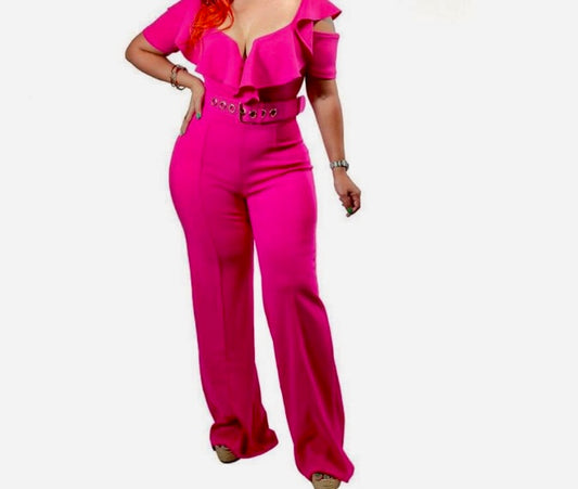 Person wearing a bright pink jumpsuit on a white background
